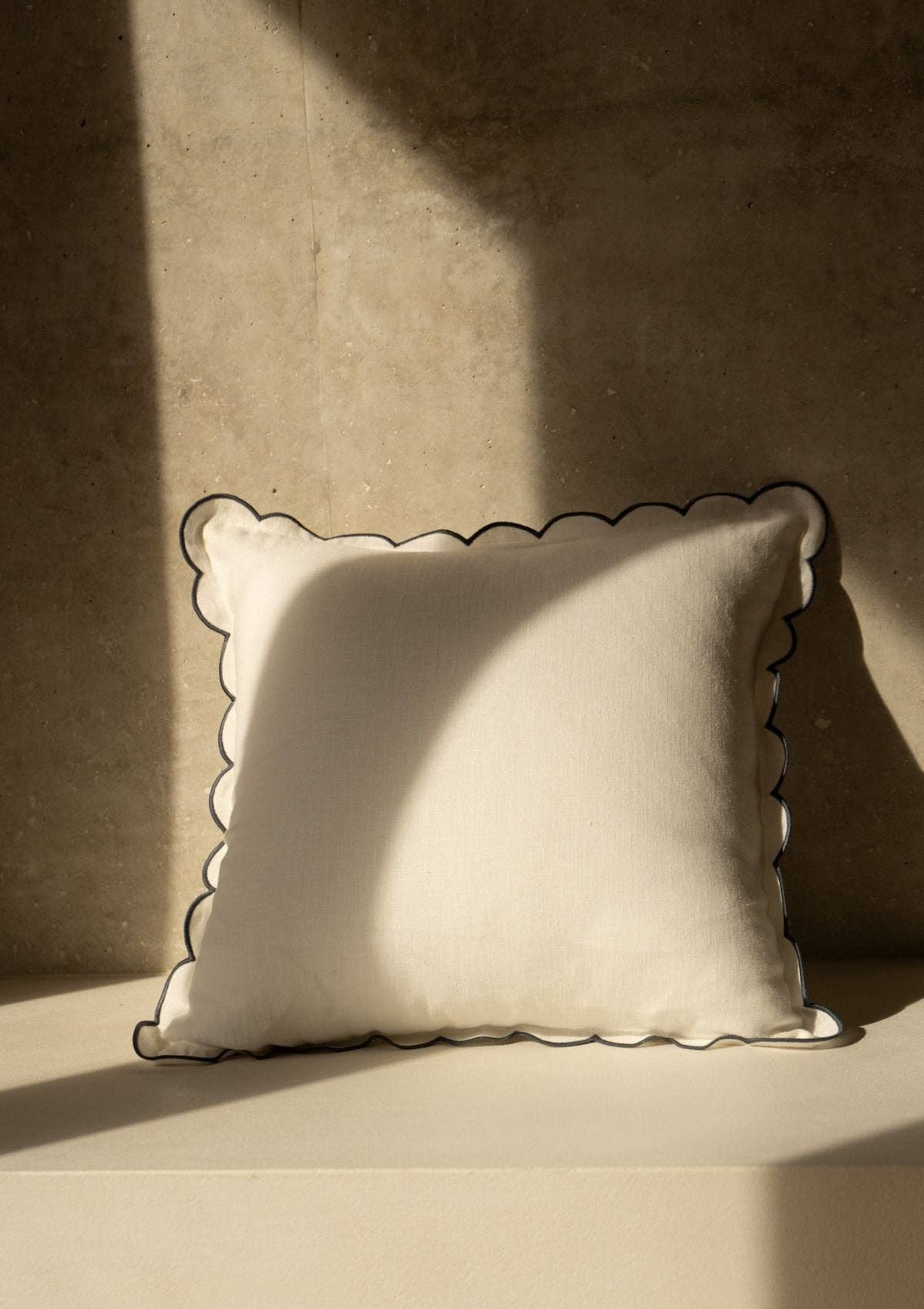 Blue scalloped on white linen cushion cover